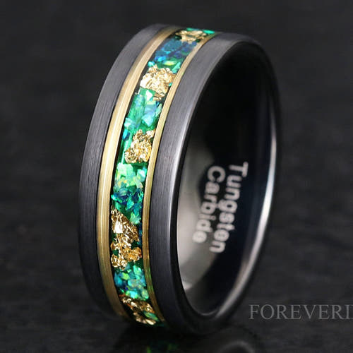 Men's 8mm black and gold tungsten wedding band with emerald opal and gold leaf inlay, matte finish