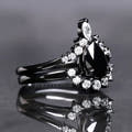 Black onyx engagement ring and curved band in black sterling silver, side view
