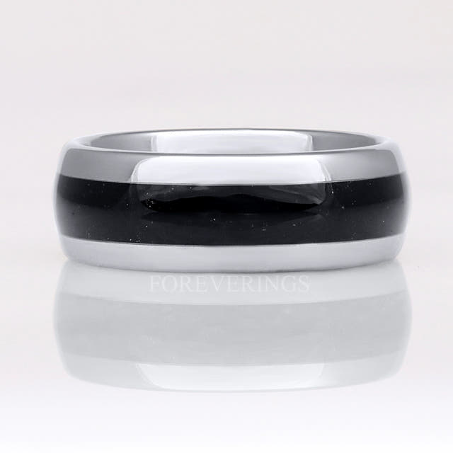 Silver tungsten black onyx ring shown straight on, polished dome with reflection