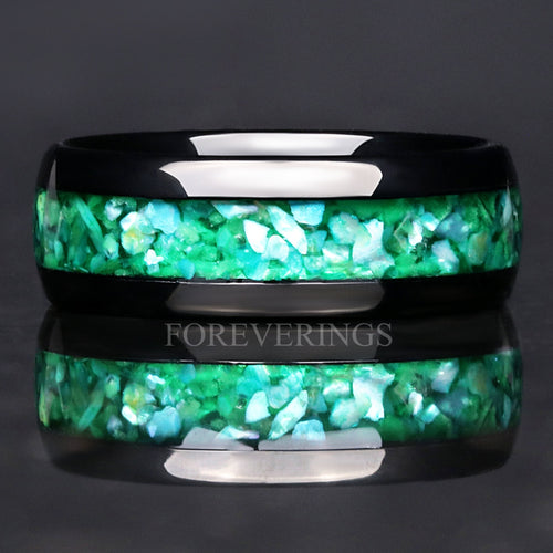 Men's 8mm black tungsten wedding band with green glow-in-the-dark inlay, lying flat