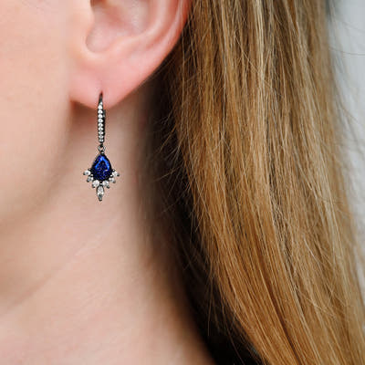 Blue sandstone drop earring in black sterling silver worn on the ear