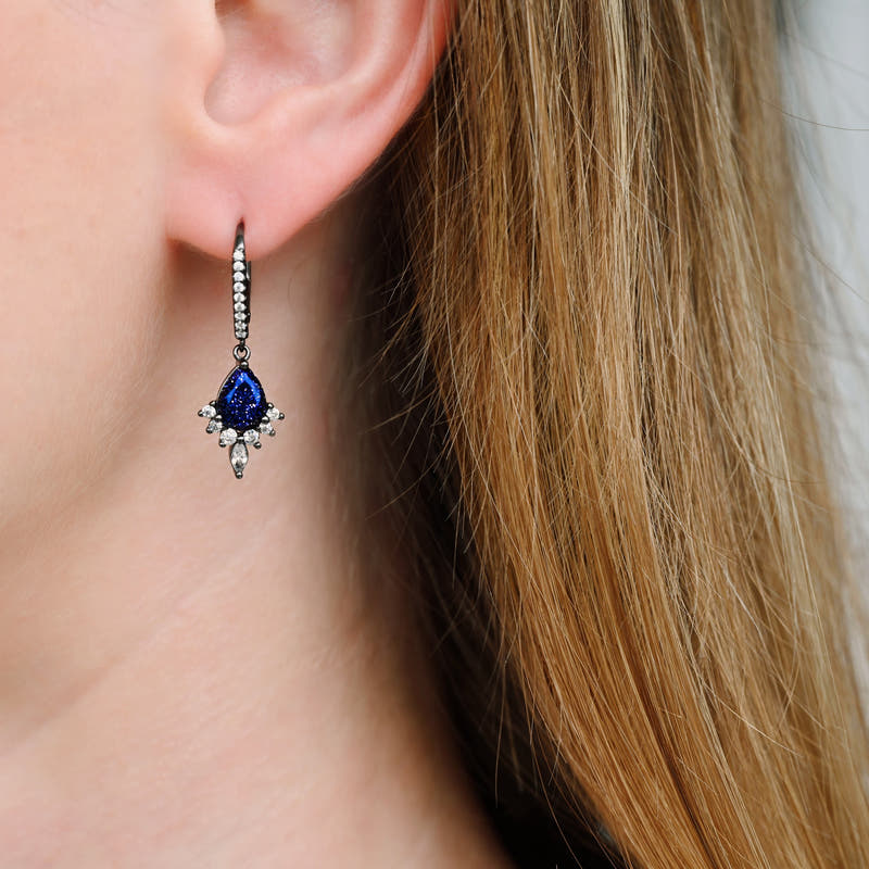 Blue sandstone drop earring in black sterling silver worn on the ear