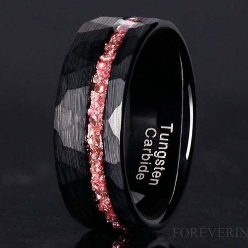 Men's 8mm black hammered tungsten band with crushed morganite inlay, angled close-up