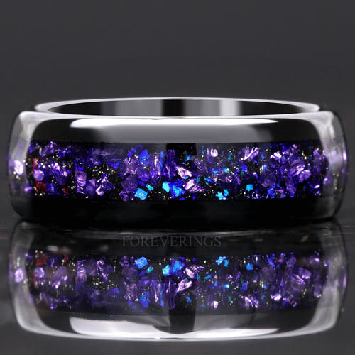 Black tungsten wedding band with alexandrite and purple sandstone inlay, close front view