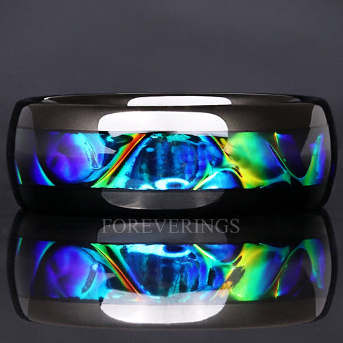 8mm black tungsten wedding band with color-shifting azure dichrolam inlay, shown straight on