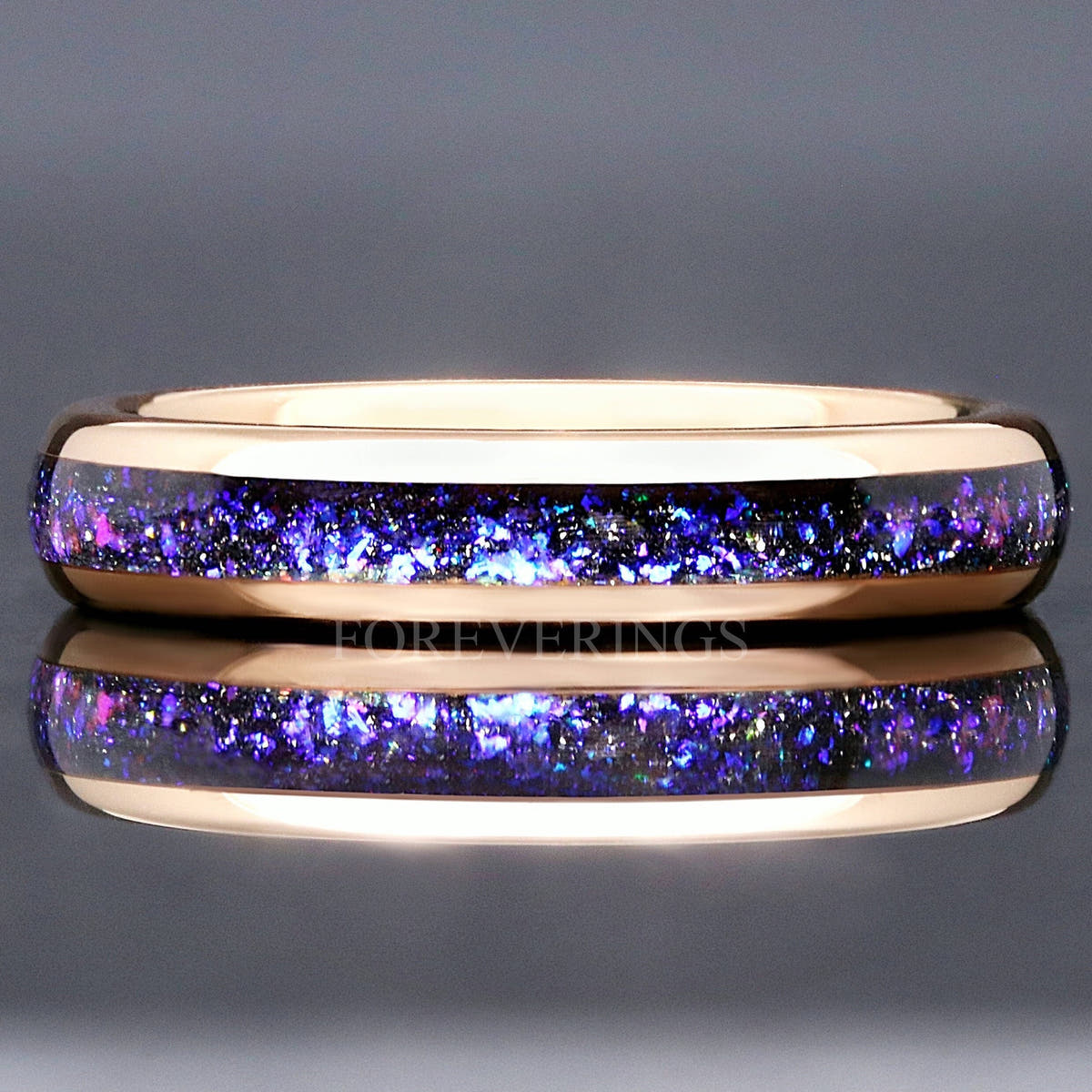 4mm rose gold tungsten ring with Orion nebula sandstone inlay, shown straight on with a reflection below