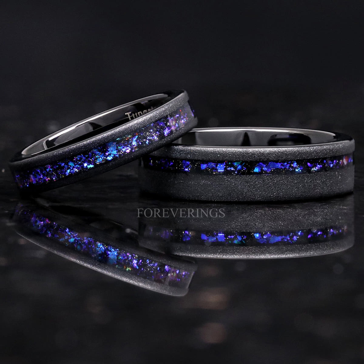 Matching sandblasted black tungsten couples ring set with Orion nebula sandstone inlay, 6mm and 4mm