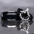 Matching black couples ring set with a pear black onyx engagement ring and 8mm tungsten band