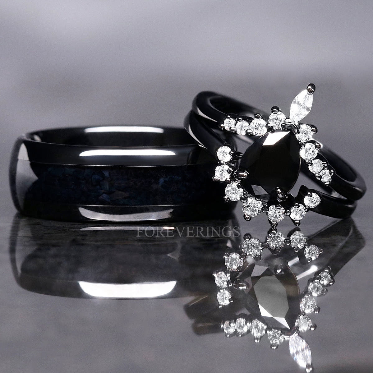 Matching black couples ring set with a pear black onyx engagement ring and 8mm tungsten band