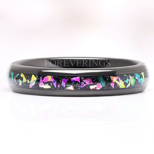 4mm black tungsten wedding band with a multicolor supernova inlay, lying flat front view