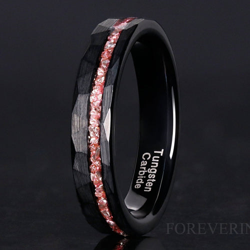 4mm hammered black tungsten band with an offset crushed morganite inlay, standing at an angle