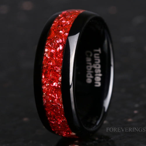 8mm black tungsten wedding band with crushed ruby inlay, standing at an angle