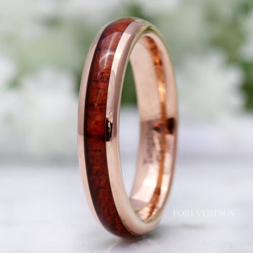 4mm rose gold tungsten band with koa wood inlay, standing close-up