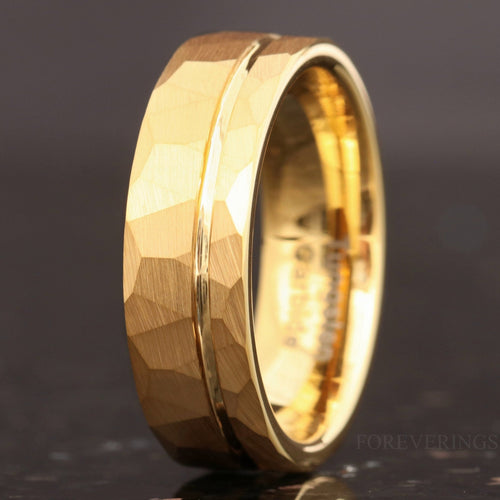 Men's 7mm hammered gold tungsten wedding band, angled to show the polished interior