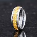 Men's 8mm silver tungsten wedding band with crushed citrine inlay, standing angled