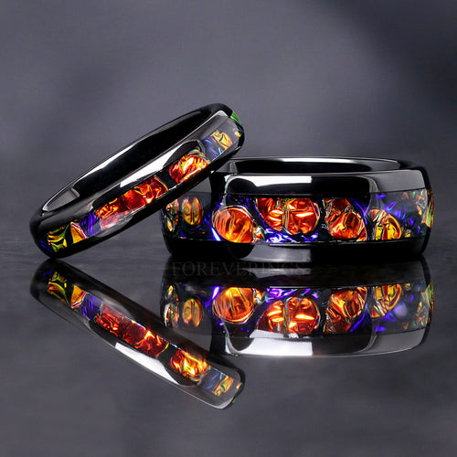 Matching black tungsten couples ring set with red and orange dichrolam inlay, 8mm and 4mm