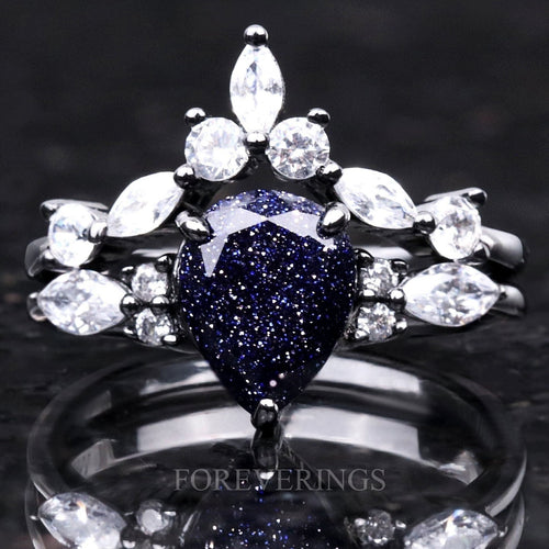 Black sterling silver bridal set with a pear-cut blue sandstone and marquise crown band, straight on
