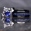 Matching black couples ring set with a blue sapphire engagement ring and 8mm tungsten band
