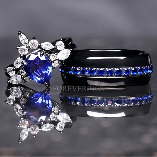 Matching black couples ring set with a blue sapphire engagement ring and 8mm tungsten band