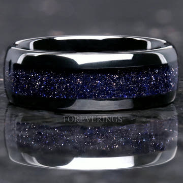 Men's black tungsten wedding band with blue sandstone Great Rift nebula inlay, front view
