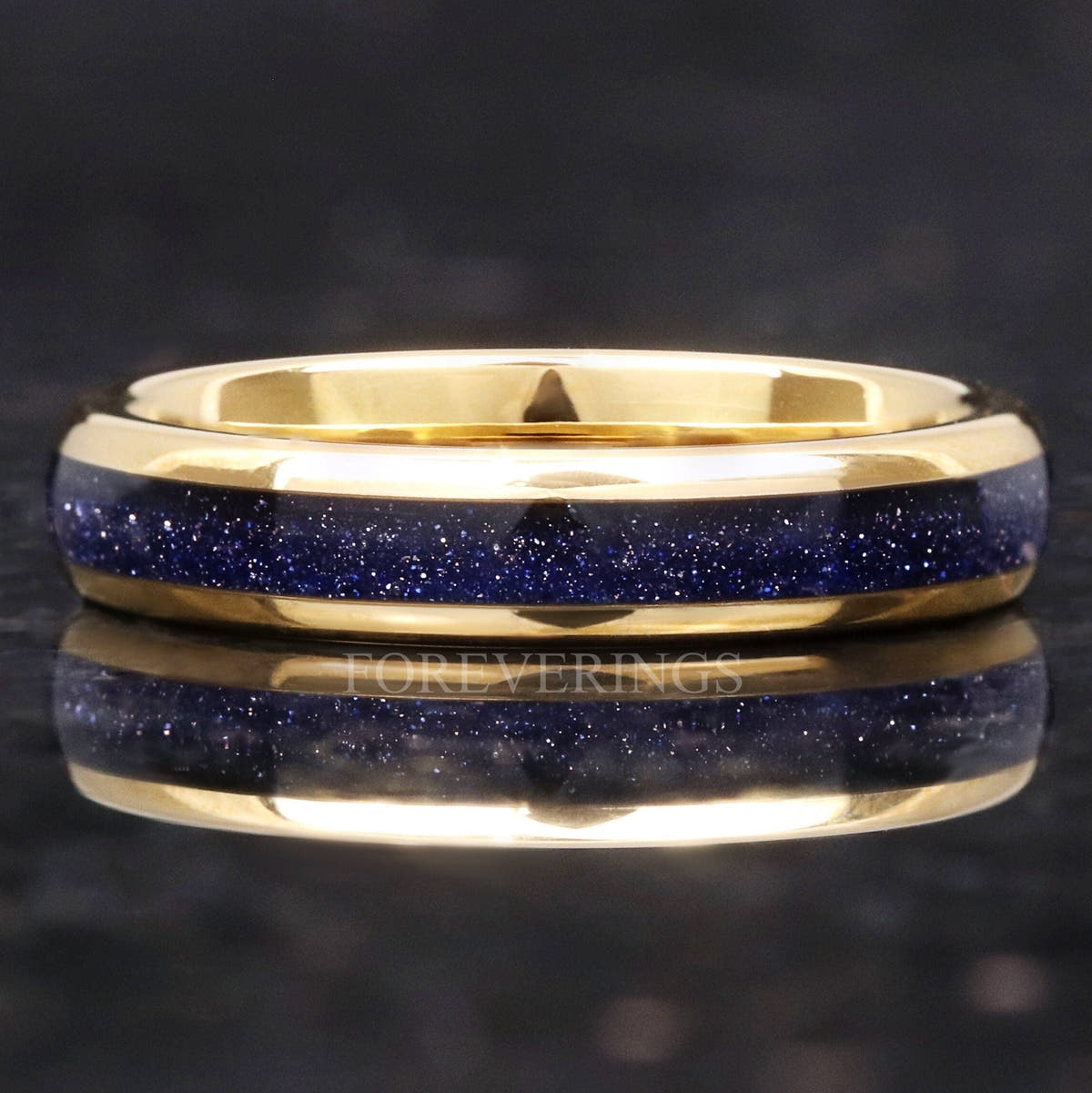 4mm gold tungsten ring with Great Rift blue sandstone inlay, lying flat with reflection