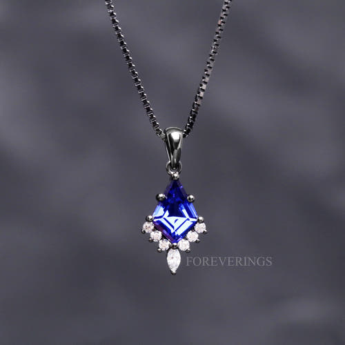 Orion Nebula pendant necklace in black sterling silver with a kite cut blue sapphire on a box chain