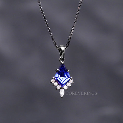 Orion Nebula pendant necklace in black sterling silver with a kite cut blue sapphire on a box chain