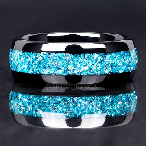 Men's 8mm black tungsten wedding band with crushed aquamarine inlay, straight-on close-up