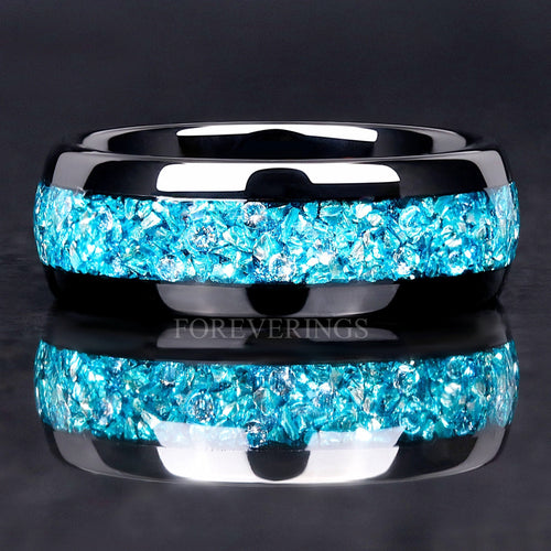 Men's 8mm black tungsten wedding band with crushed aquamarine inlay, straight-on close-up