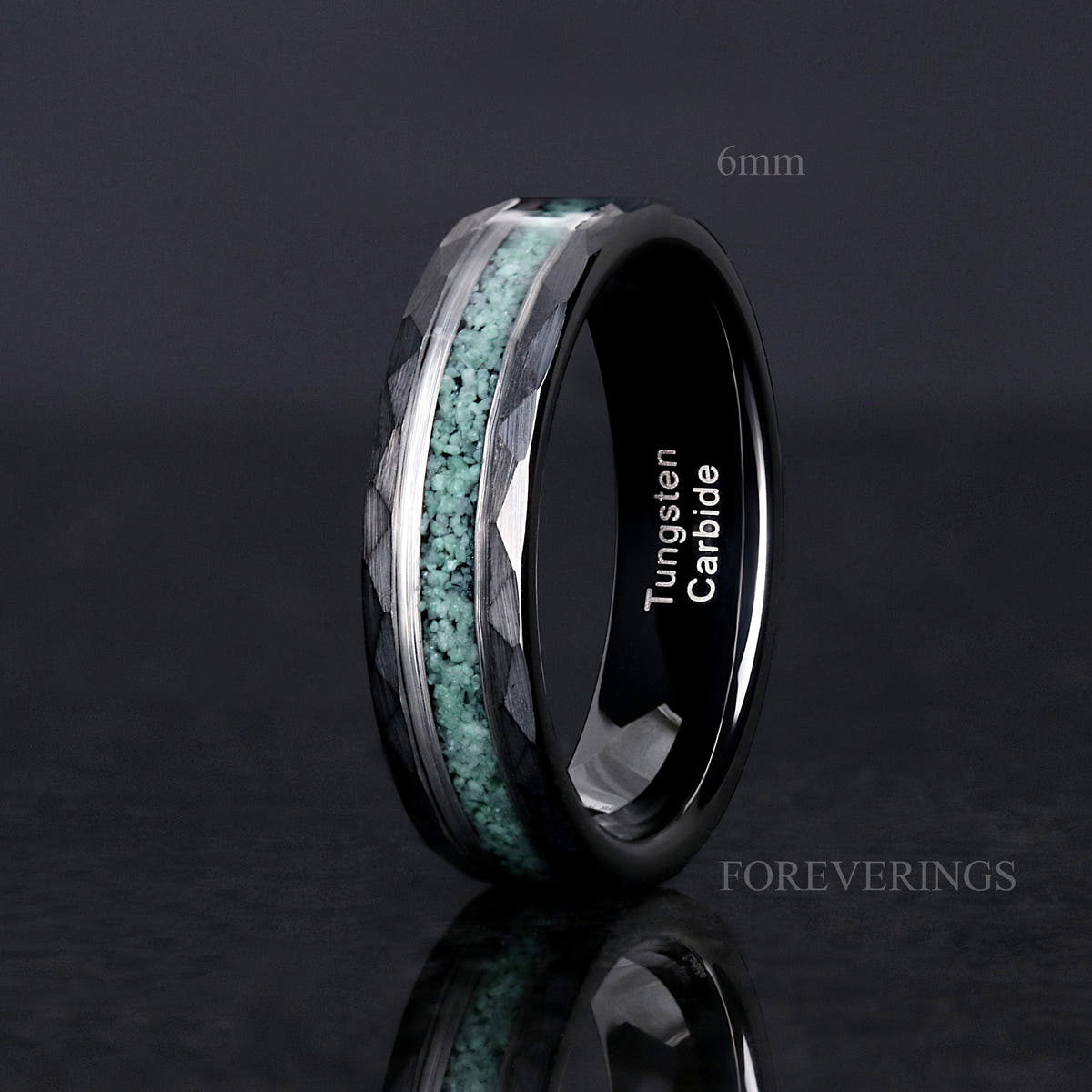 Men's black tungsten ring labeled 6mm with crushed moss agate stripe, standing angled