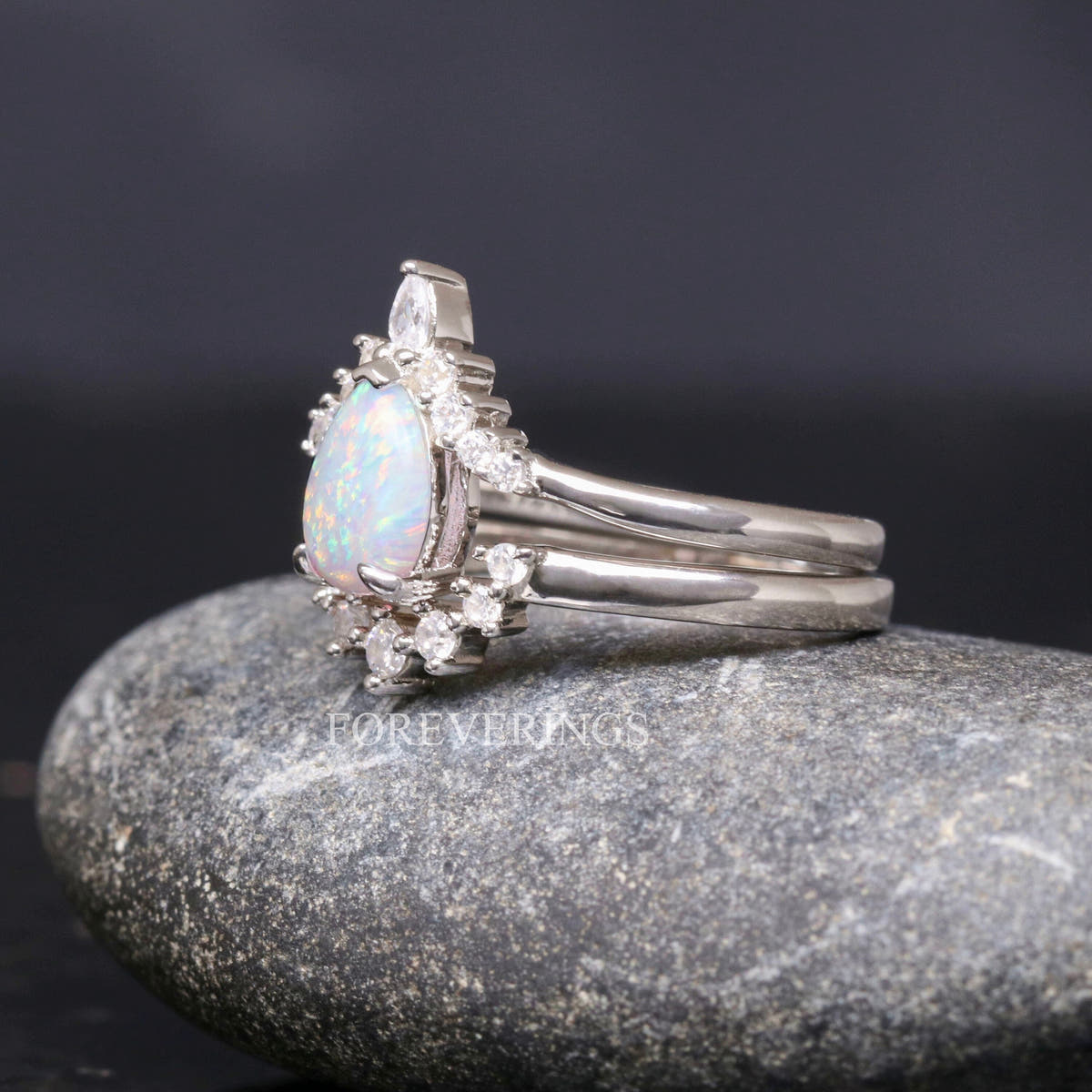 White fire opal engagement ring and nesting band in sterling silver, side profile