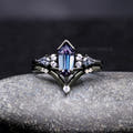 Women's black sterling silver alexandrite engagement ring set with kite side stones, front view