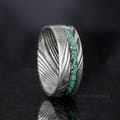Men's 8mm Damascus steel ring with green moss agate inlay, standing upright