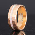 Men's 8mm hammered rose gold tungsten band with white fire opal inlay, standing at an angle