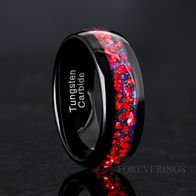8mm black tungsten ring with ruby and blue sandstone inlay, standing at an angle