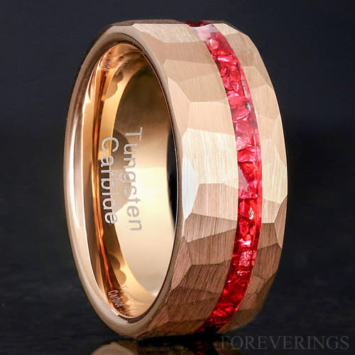 Men's 8mm hammered rose gold tungsten band with an offset crushed ruby stripe, standing upright
