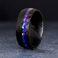 Men's 8mm black Damascus steel band with Orion nebula sandstone inlay, standing upright
