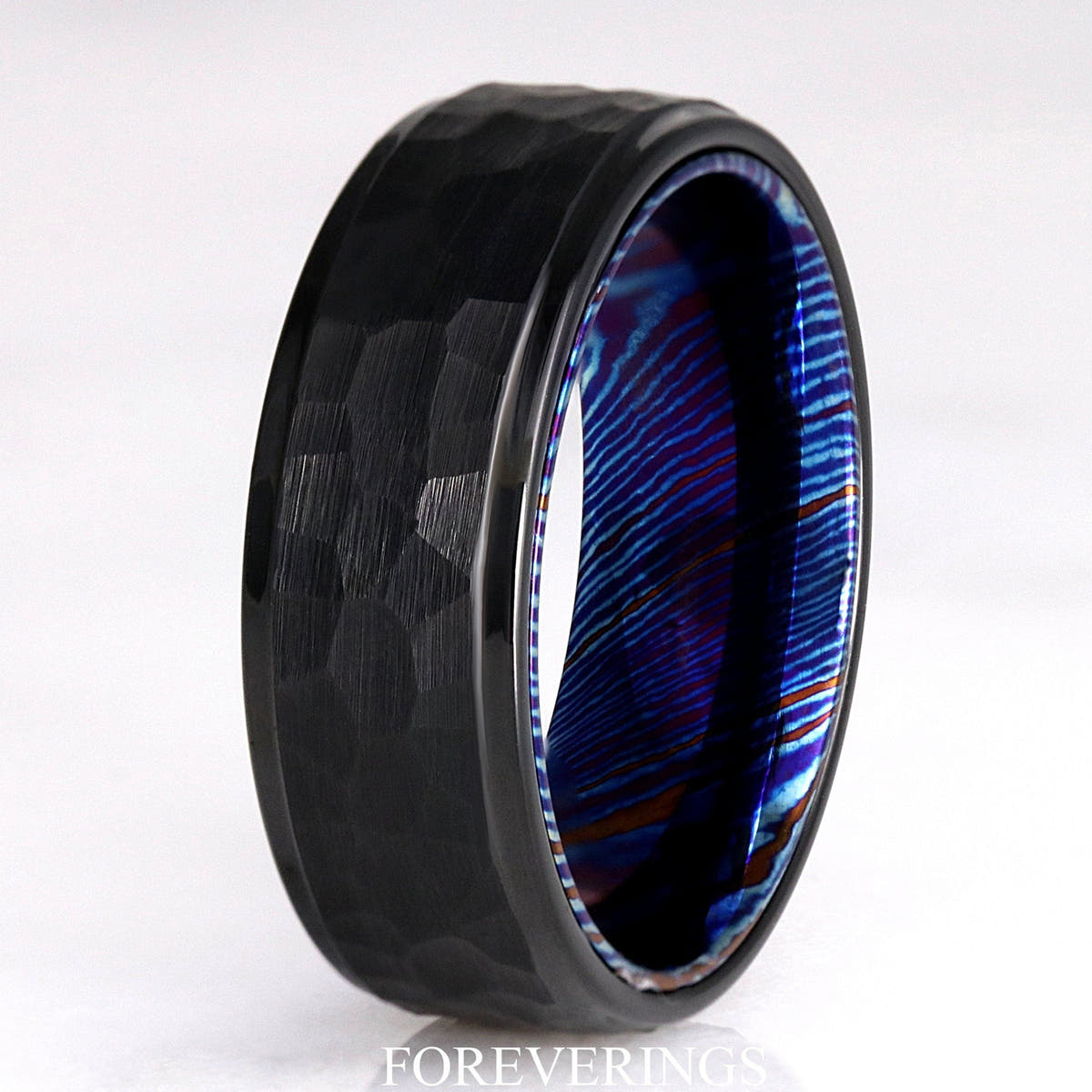 Men's 8mm hammered black tungsten ring with a blue Timascus lining