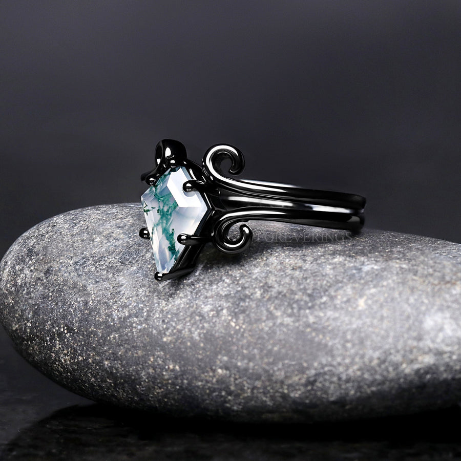 Women's black sterling silver kite cut moss agate ring with swirl details, angled side view