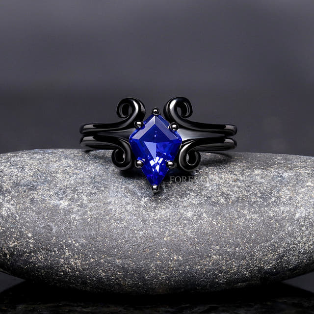 Women's black sterling silver sapphire bridal set with swirl accents, shown straight on