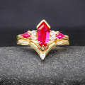 Women's gold sterling silver bridal set with an elongated hexagon ruby, shown straight on