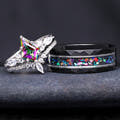 Matching couples ring set with an 8mm black and silver tungsten galaxy band and a silver mystic topaz bridal set