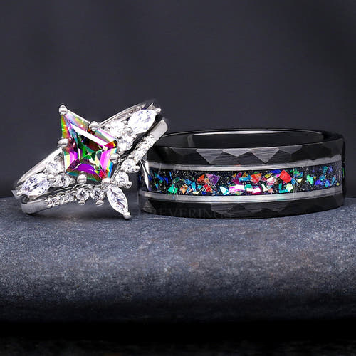 Matching couples ring set with an 8mm black and silver tungsten galaxy band and a silver mystic topaz bridal set