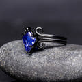 Black sterling silver sapphire engagement ring and swirl band, angled side view