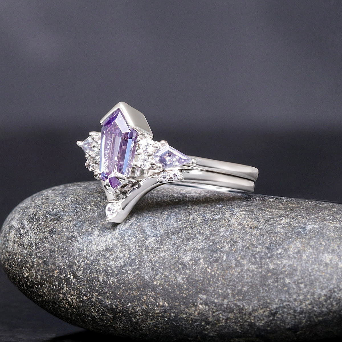 Sterling silver alexandrite engagement ring and V-shaped band, angled side view