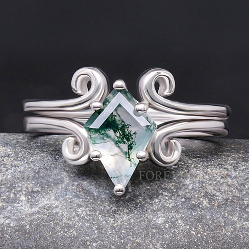 Women's kite-cut moss agate ring on a twirling sterling silver band, shown straight on