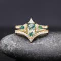 Women's gold sterling silver moss agate engagement ring with a curved pave band, front view
