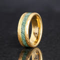 Men's 8mm gold hammered tungsten band with green moss agate inlay, standing on edge