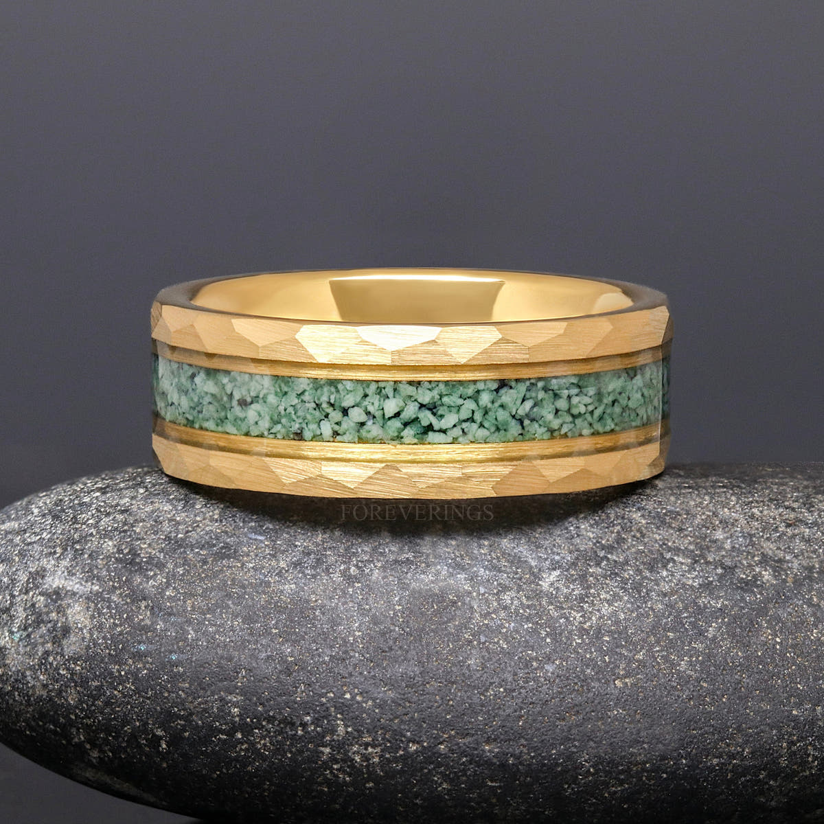 8mm gold tungsten moss agate ring lying flat, front view of the hammered edges