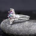 Sterling silver mystic topaz engagement ring and curved band, angled side view